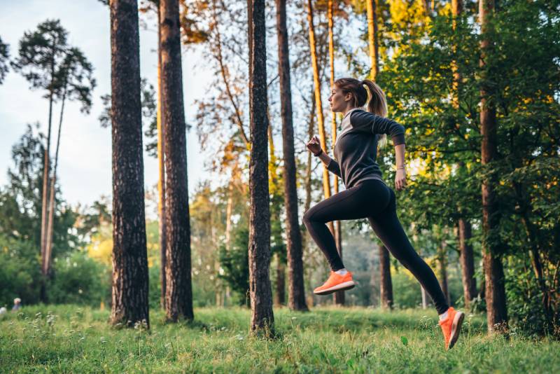 woman running in woods