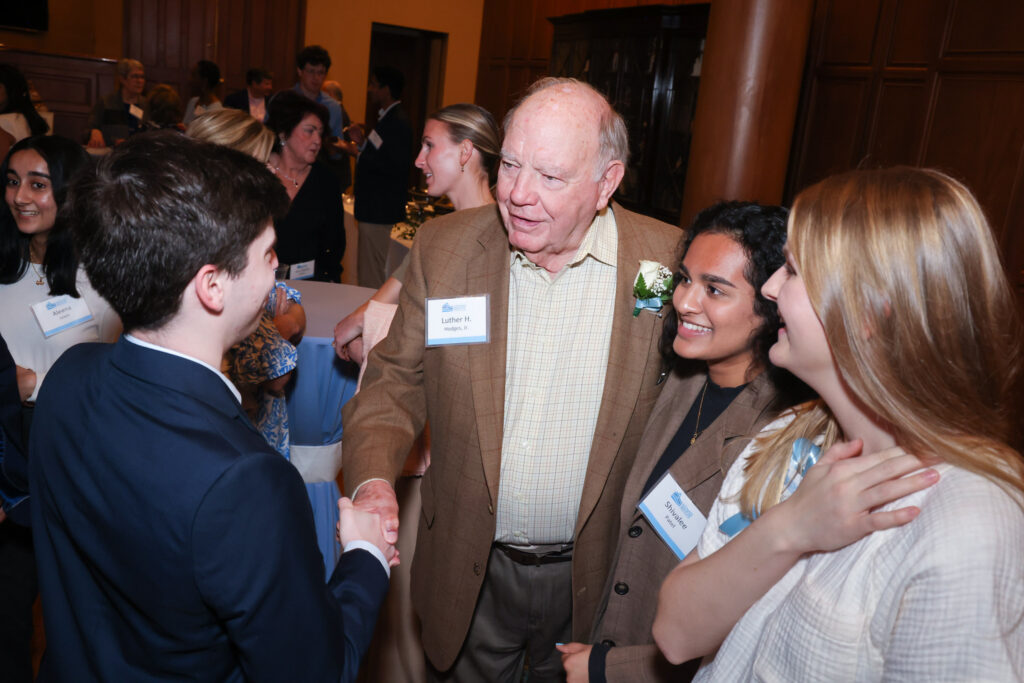 Luther Hodges with scholars