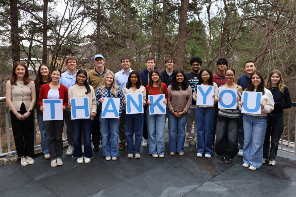 Hodges Scholars group shot holding thank you cards