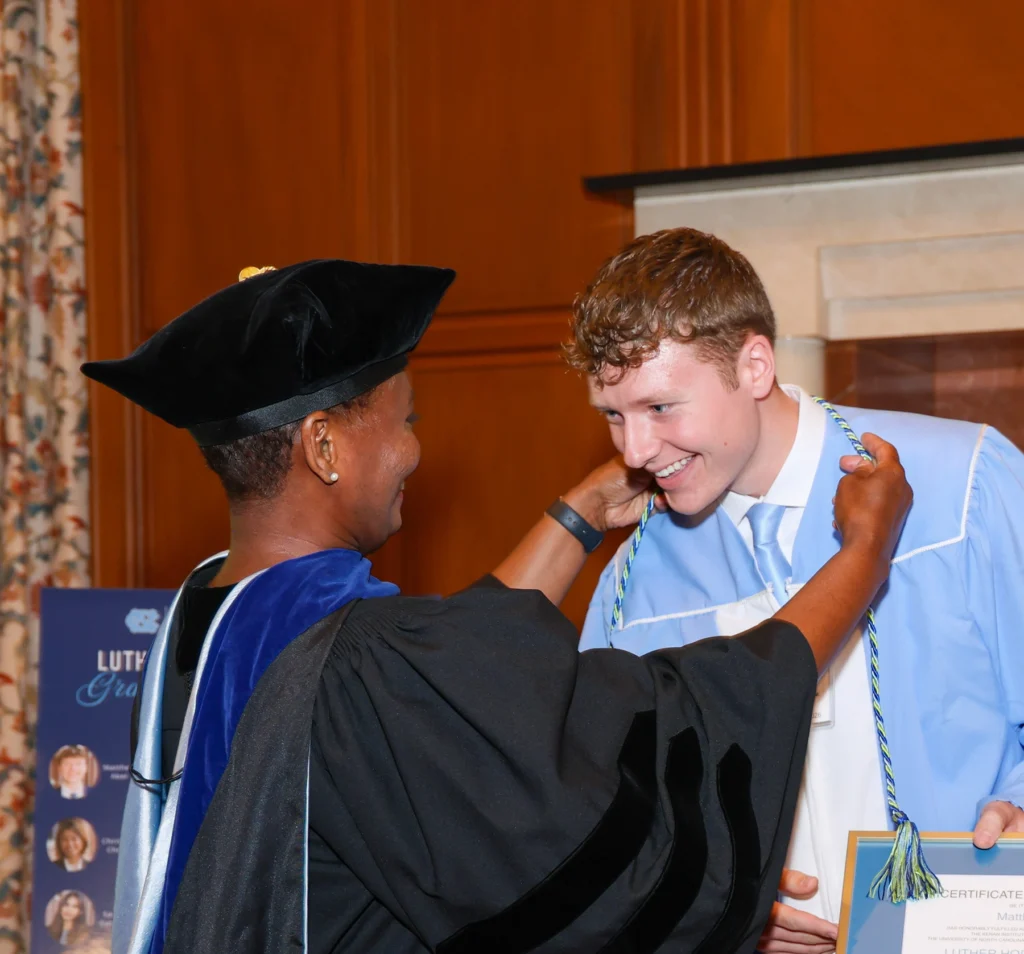 Kim Allen and scholar at graduation